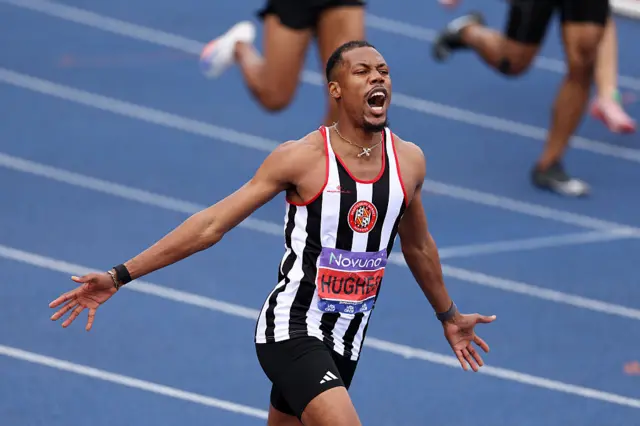 Zharnel Hughes celebrates victory