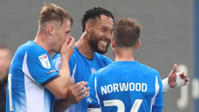 Kyle Wootton celebrates his goal for Stockport against Bolton