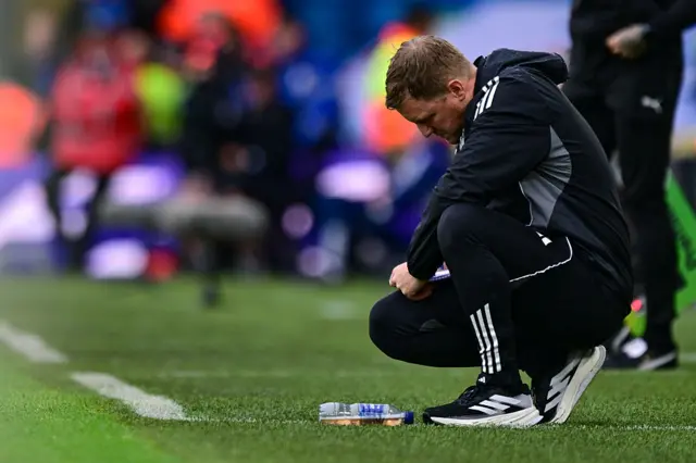 Newcastle United Head Coach Eddie Howe takes notes during the Premier League match between Leeds United and Newcastle United at Elland Road on August 30, 2025 in Leeds, England.