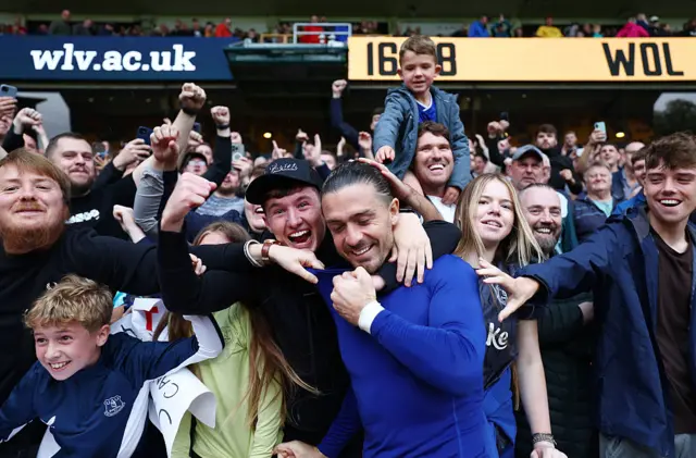 Jack Grealish of Everton celebrates with Everton fans after the team's victory in the Premier League match between Wolverhampton Wanderers and Everton at Molineux on August 30, 2025 in Wolverhampton, England.