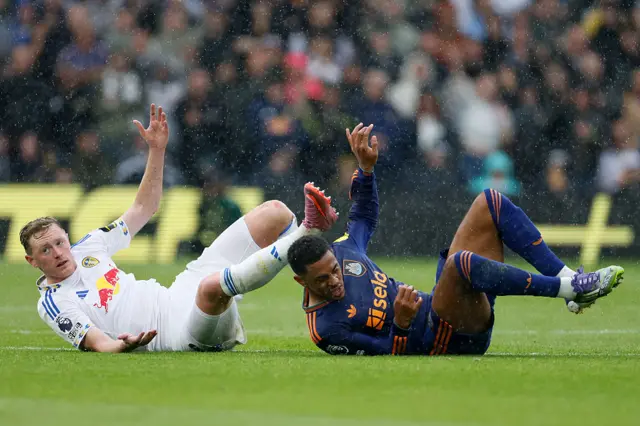 Sean Longstaff of Leeds United and Jacob Ramsey of Newcastle United after challenge during the Premier League match between Leeds United and Newcastle United at Elland Road on August 30, 2025 in Leeds, England.