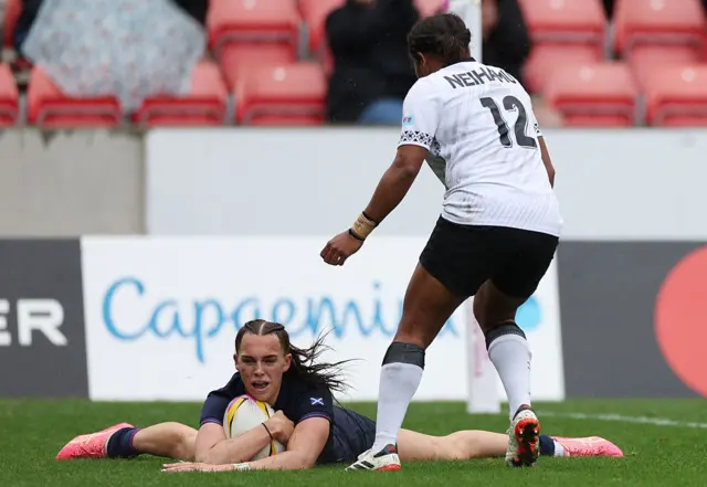 Emma Orr slides in for her score in the second half