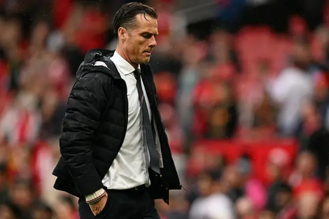 Burnley's English manager Scott Parker leaves the field at the end of the English Premier League football match between Manchester United and Burnley