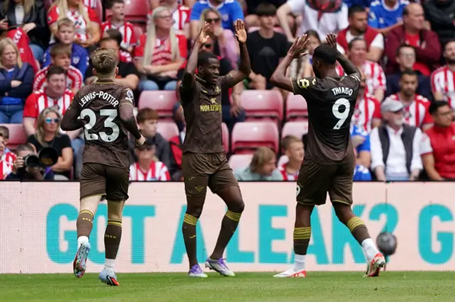 Brentford's Dango Ouattara (centre) celebrates scoring before the goal is disallowed for offside