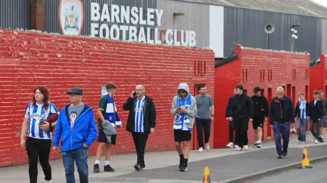 Huddersfield fans walking outside Barnsley's ground