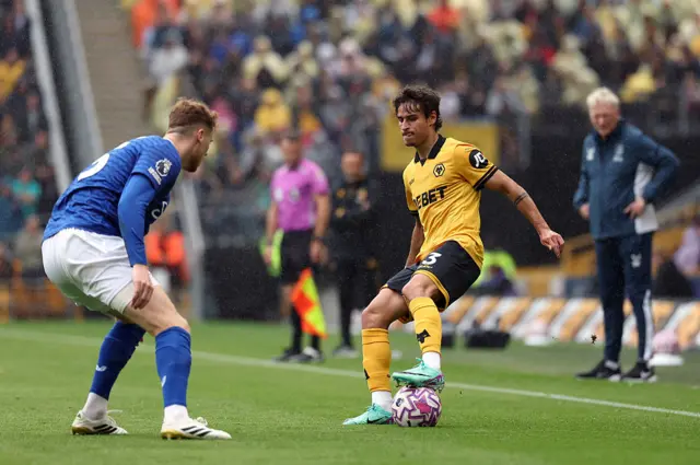 Hugo Bueno of Wolverhampton Wanderers controls the ball whilst under pressure from Jake O'Brien of Everton during the Premier League match between Wolverhampton Wanderers and Everton at Molineux on August 30, 2025 in Wolverhampton, England.