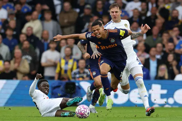 Newcastle United's Danish striker #18 William Osula (C) is tackled