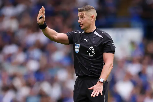 Match referee Robert Jones reacts during the Premier League match between Chelsea and Fulham at Stamford Bridge on August 30, 2025 in London, England.