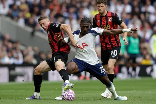 Bournemouth's French defender #03 Adrien Truffert (L) vies with Tottenham Hotspur's Ghanian striker #20 Mohammed Kudus