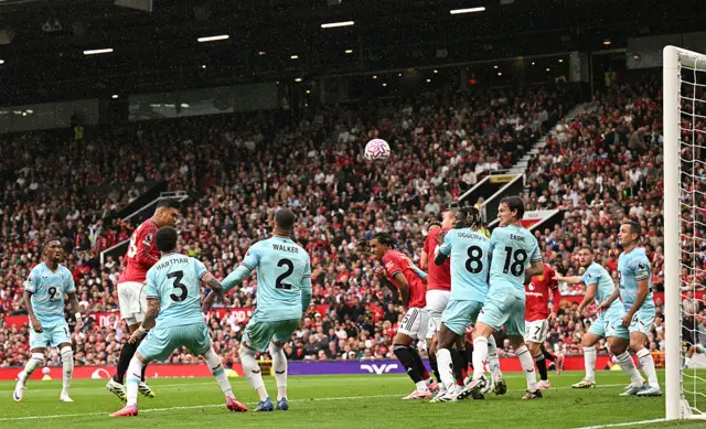 Manchester United's Brazilian midfielder #18 Casemiro (2L) heads the ball against the crossbar which rebounds and hits Burnley's English-born Irish midfielder #24 Josh Cullen for an own goal