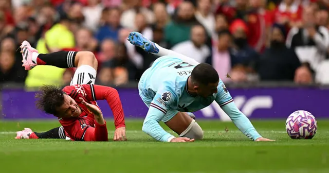 Burnley's English defender #02 Kyle Walker (R) tangles with Manchester United's English midfielder #07 Mason Mount (L) resulting in calls for a penalty