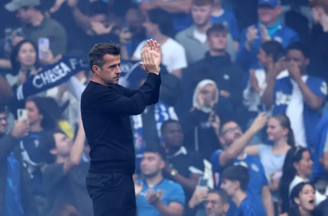 Fulham manager Marco Silva applauds fans after the match