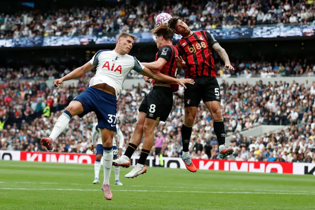 Tottenham Hotspur's Dutch defender #37 Micky van de Ven (L) vies with Bournemouth's English midfielder #08 Alex Scott (C) and Bournemouth's Argentinian defender #05 Marcos Senesi