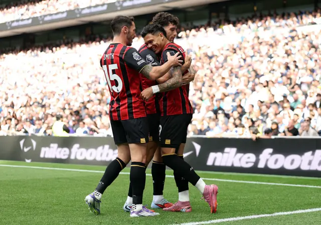 Evanilson of AFC Bournemouth celebrates scoring his team's first goal with teammates Adam Smith and Marcos Senesi during the Premier League match between Tottenham Hotspur and Bournemouth at Tottenham Hotspur Stadium on August 30, 2025 in London, England. (