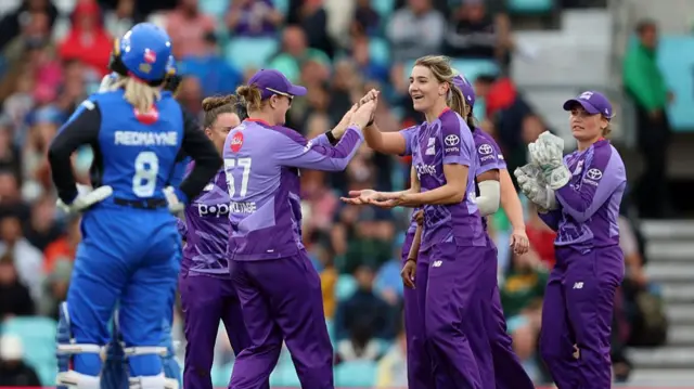 Annabel Sutherland of Northern Superchargers celebrates with teammates after taking the wicket of Eva Gray of London Spirit