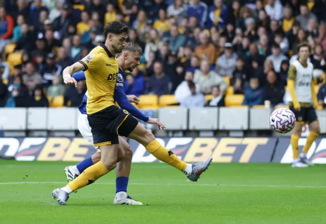 Everton score their third.