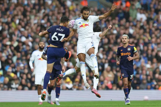 Leeds United's English striker #09 Dominic Calvert-Lewin (R) jumps against Newcastle United's English midfielder #67 Lewis Miley