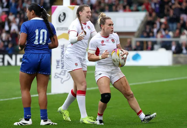 Meg Jones celebrating a try