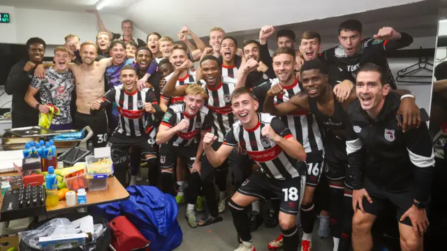 Grimsby players celebrate in changing rooms