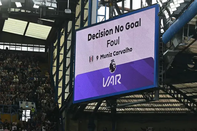 The big screen display the news that a Fulahm goal has been disallowed for a foul in the build-up.