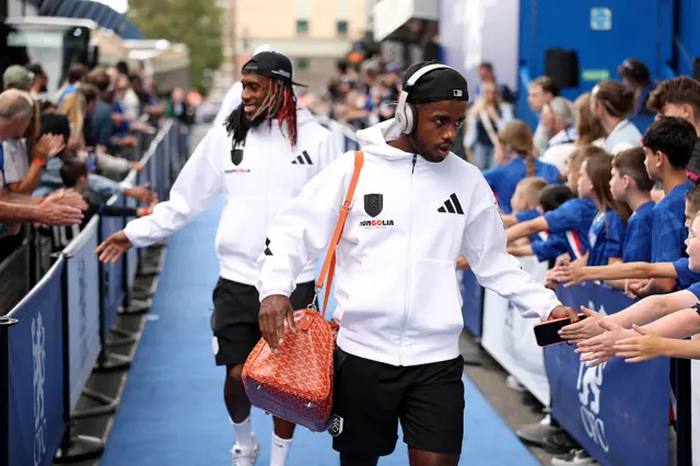 Fulham players arrive at Stamford Bridge.