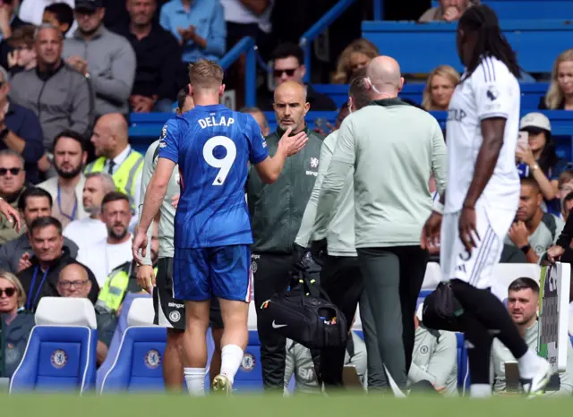 Chelsea's Liam Delap shakes hands with manager Enzo Maresca