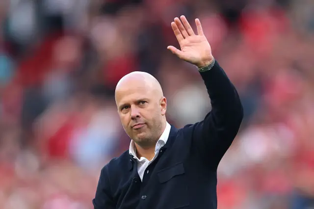 Arne Slot, Manager of Liverpool, acknowledges the fans