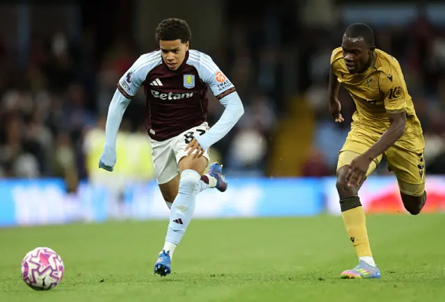 Bradley Burrowes of Aston Villa runs with the ball