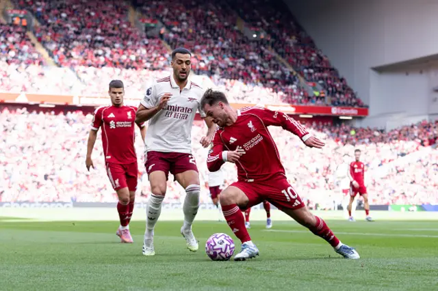 Alexis Mac Allister of Liverpool is challenged by Mikel Merino