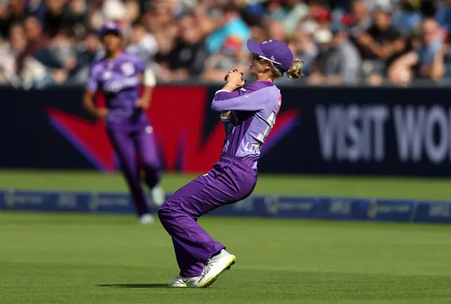 Phoebe Litchfield of Northern Superchargers takes the catch to dismiss Sophie Devine of Southern Brave