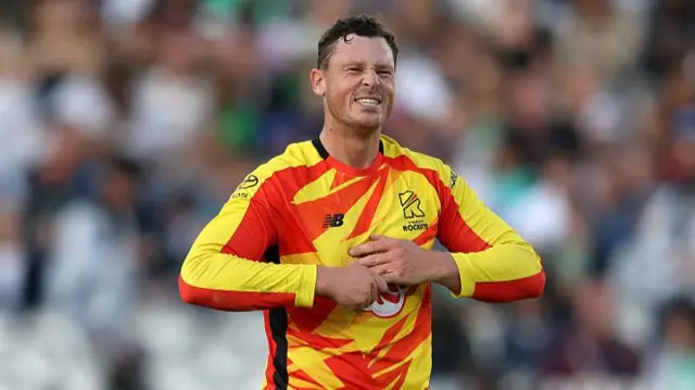 George Linde of Trent Rockets reacts as he holds his finger after dropping Jordan Cox of Oval Invincibles