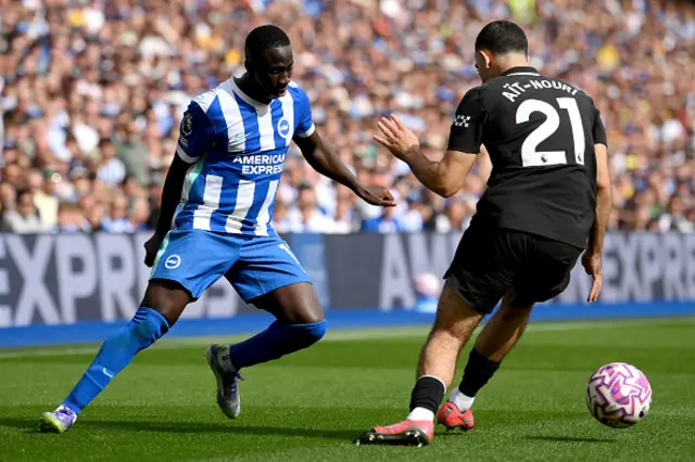 Yankuba Minteh of Brighton & Hove Albion controls the ball past Rayan Ait-Nouri