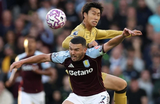 Aston Villa's John McGinn in action with Crystal Palace's Daichi Kamada
