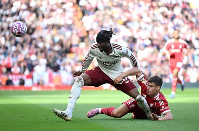 Noni Madueke of Arsenal is challenged by Milos Kerkez