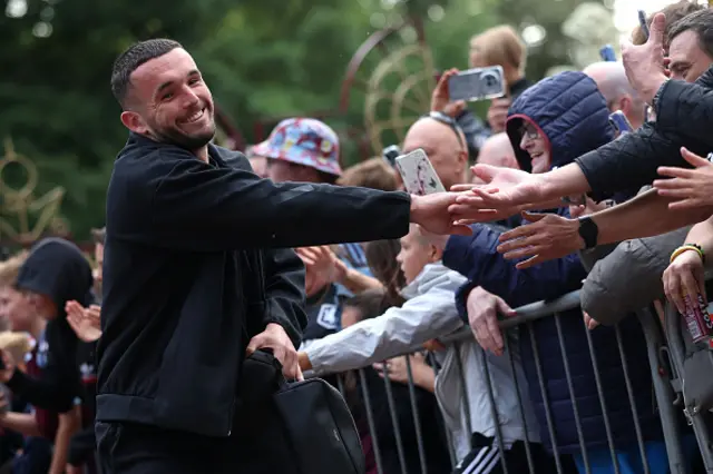 John McGinn of Aston Villa interacts with fans