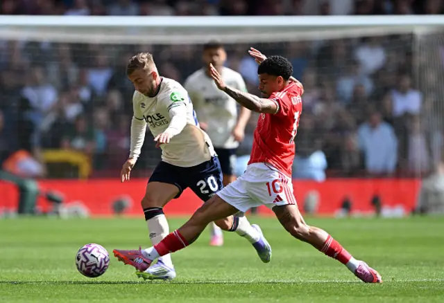 Jarrod Bowen of West Ham United is challenged by Morgan Gibbs-White