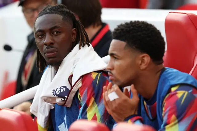 Eberechi Eze is seen on the substitutes bench