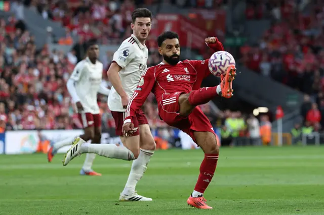 Mohamed Salah (R) clears as Arsenal's English midfielder #41 Declan Rice (L) looks on