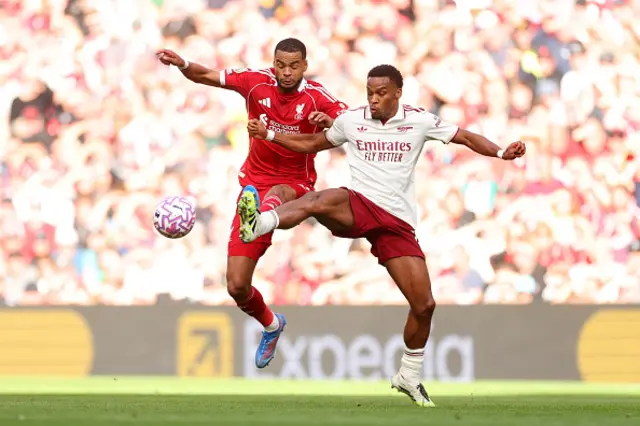 Cody Gakpo of Liverpool clashes with Jurrien Timber