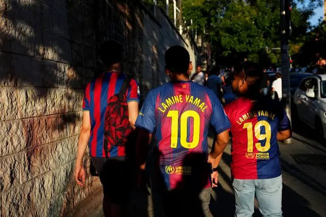 Barcelona fans with Lamine Yamal on the back
