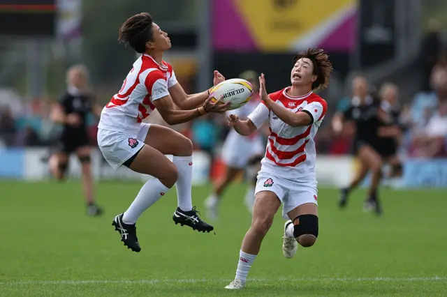 Two Japan players clashing together