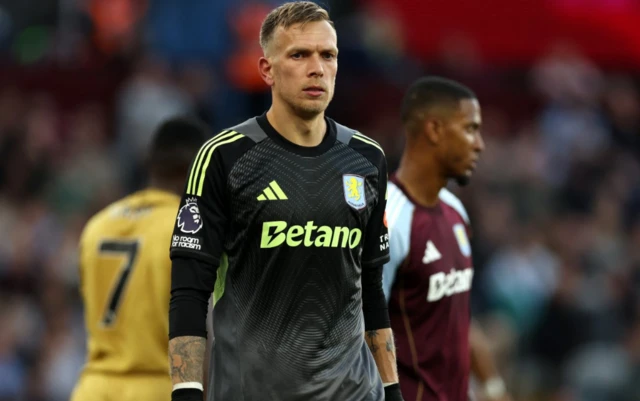 Aston Villa's Marco Bizot looks on