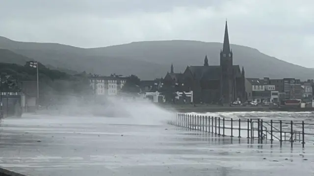 Largs with waves coming over the promenade
