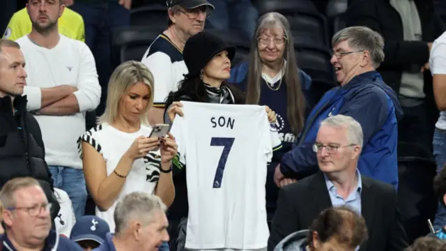 a supporter with a shirt with the name of Son Heung-Min