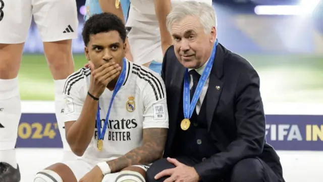Carlo Ancelotti, Head Coach of Real Madrid, speaks to Rodrygo