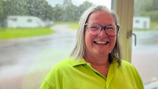 Claire in a green shirt