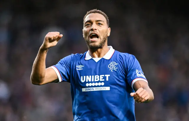 Cyriel Dessers celebrates after scoring a penalty late in the first half