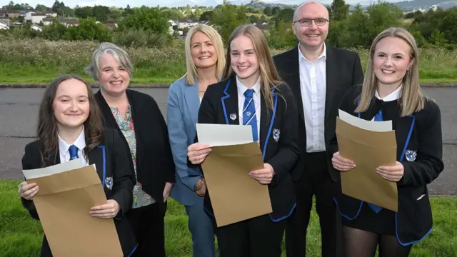 S5 pupils at Bannockburn High celebrate their results, with (back, from left) Chief Education Officer Bryony Monaghan, Head Teacher Karen Hook & Convener of Social Work & Education, Cllr Danny Gibson.
