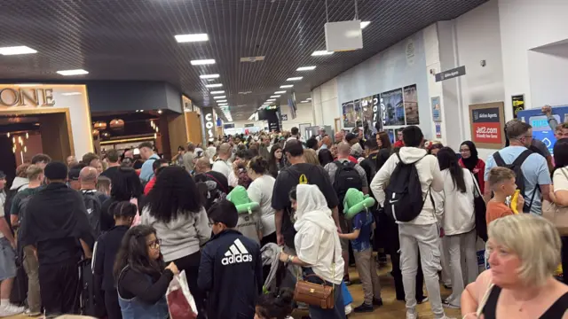 holidaymakers at the airport