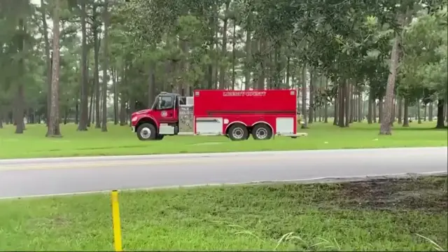 A fire engine drives down a road in Georgia.